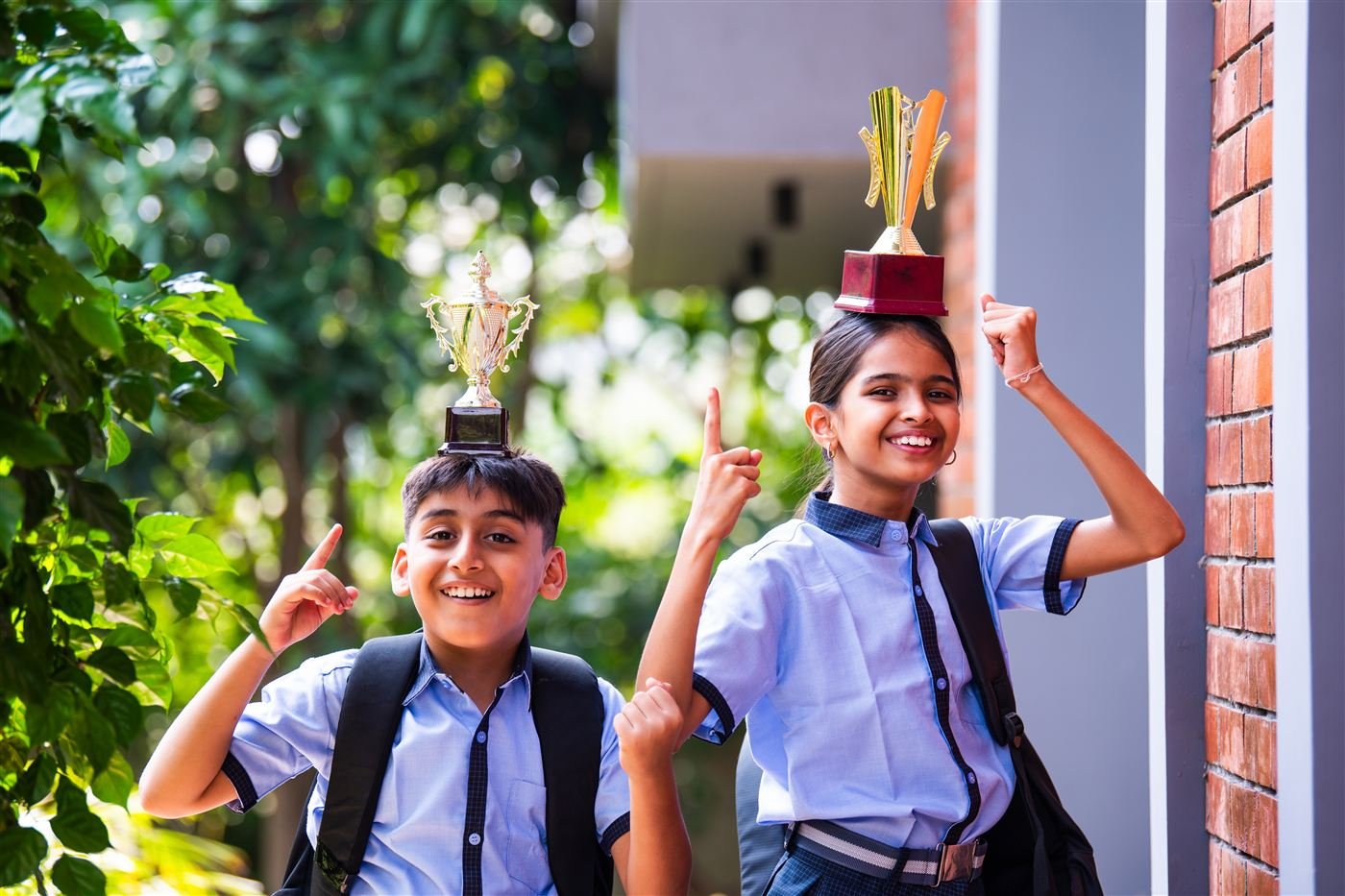 Students celebrating with trophies